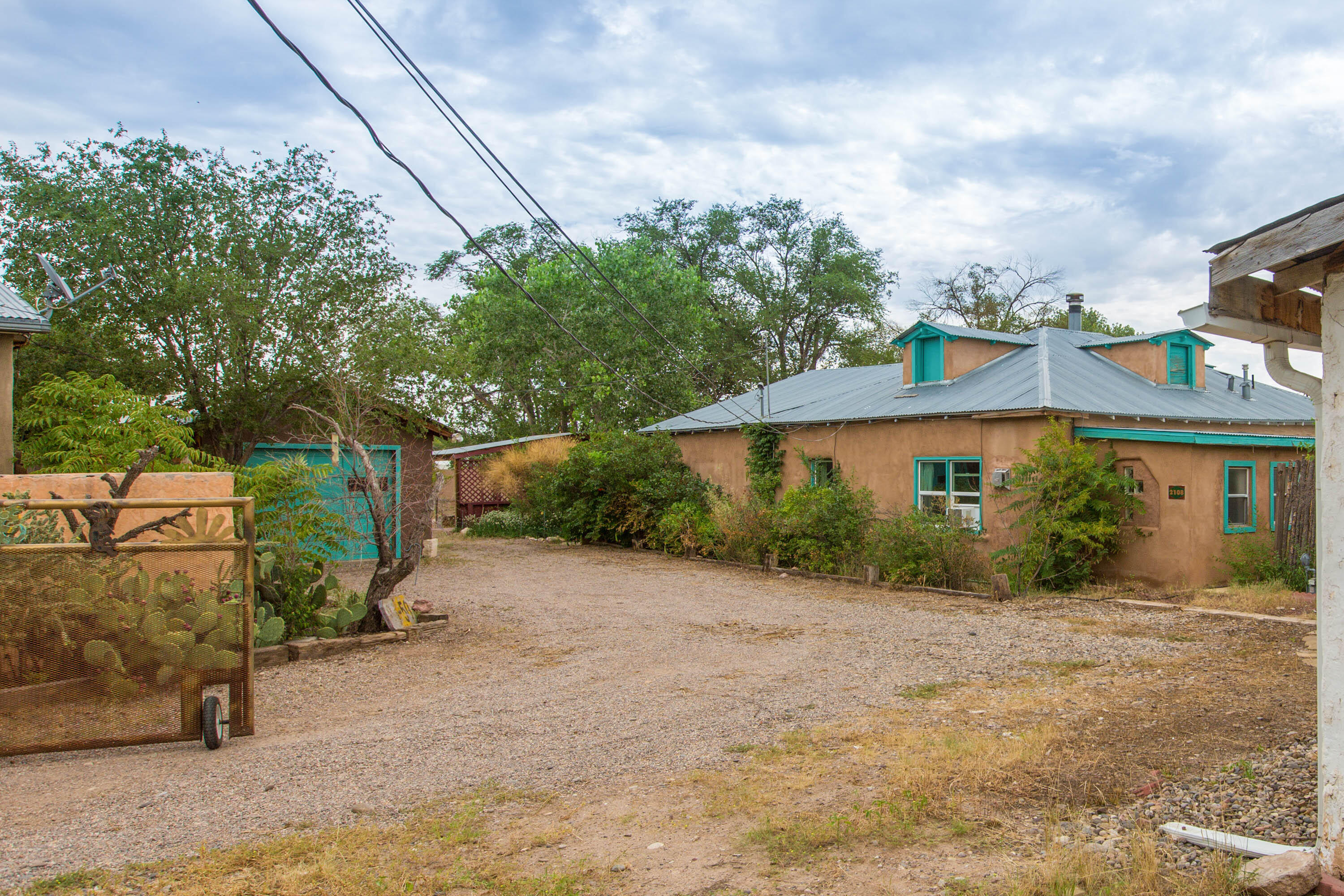 Welcome to Luna Llena Farm. A unique chance to own a charming farm & a beautifully maintained Terrone adobe home in the heart of an historic agricultural community in the South Valley. The farm offers a blend of traditional farming heritage & modern regenerative practices. The house welcomes you with unmatched charm, an updated eat-in kitchen, saltillo tile floors, banco in the living room & more. Flexible spaces include an inviting sunroom to use as an art studio, office or sitting room for the adjacent bedroom. The laundry area has a shower making it easy to convert into a second bathroom. The recently updated ''casita'' could be a rental, private guest room, or a home office. Elsewhere on the grounds you'll find a small chapel, an old dancehall waiting to be restored & reimagined.