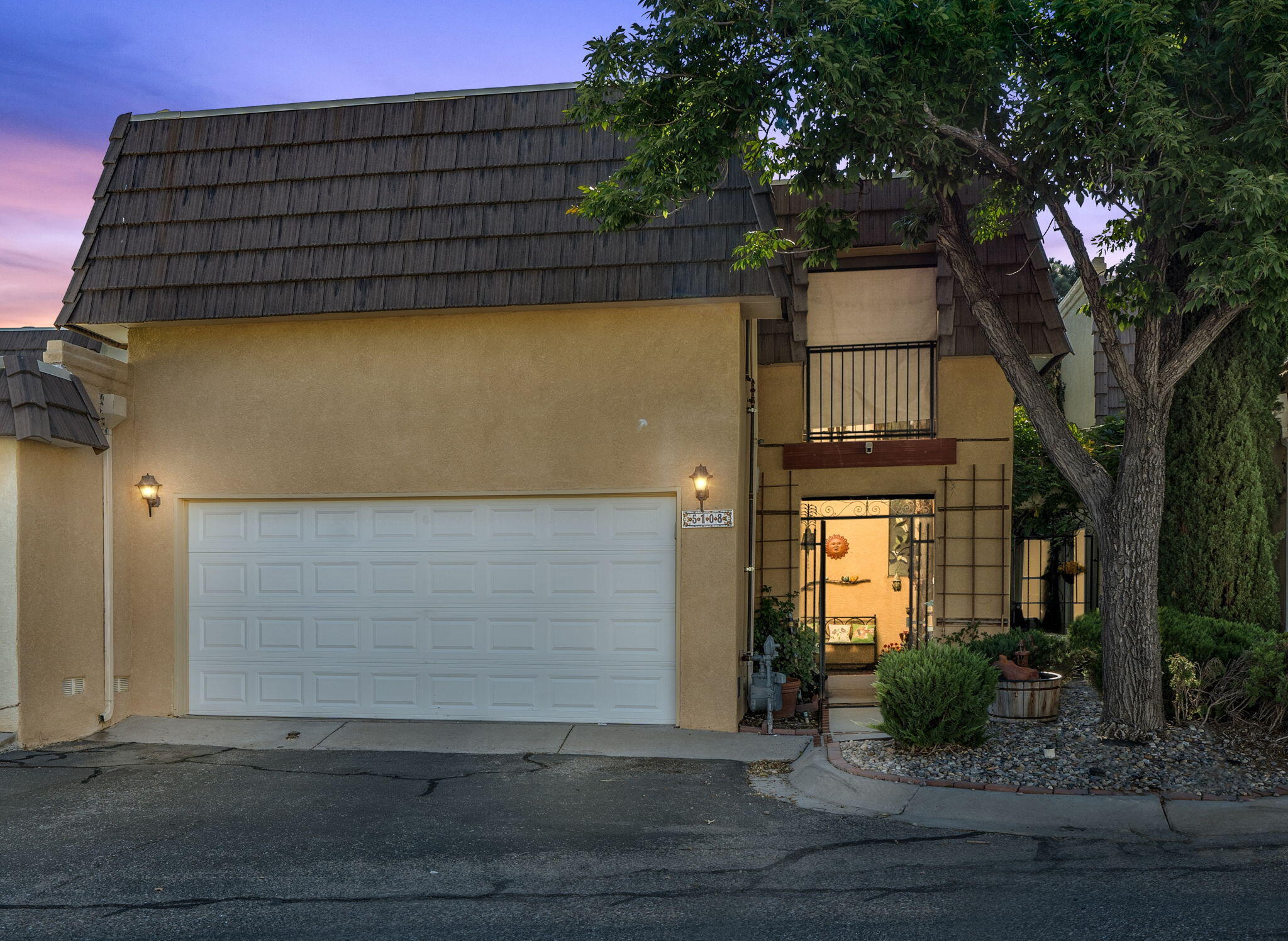 Welcome to this stunning three bedroom, three bath townhouse nestled in a peaceful community off of Osuna. Enjoy the abundance of green space surrounding the neighborhood, along with access to a sparkling community pool and a beautifully landscaped backyard perfect for relaxing or entertaining.This home boasts a tranquil setting overlooking lush greenspace, providing a serene atmosphere. The remodeled kitchen features elegant quartz countertops, sleek stainless steel appliances, and ample storage space. The updated bathrooms add a touch of modern luxury to this inviting residence. Convenience is key with a two-car garage offering plenty of parking and storage options. Don't miss out on the opportunity!