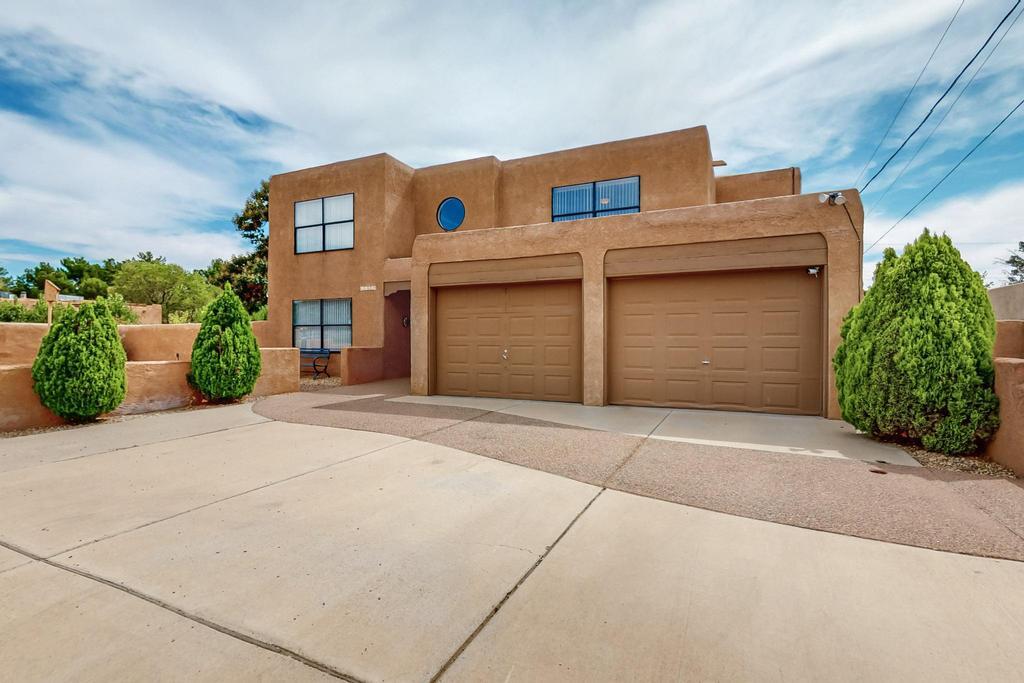 2 story home located in Quaker heights in NW Albuquerque. If you are looking for a home with lots of outdoor space and storage that in the city then this home is for you. Home features - Spacious great room and large kitchen, 2 primary bedrooms, large upstairs loft with balcony, downstairs has baseboard heating and upstairs is forced air with refrigerated A/C. Large 2 car garage attached to main home and detached  garage with 2 more garage spaces and a 2 large storage rooms, small basement down below detached garage.Covered RV storage with sewer hook up and electricity. Also another detached storage shed. This is truly unique property for storage for all the toys!