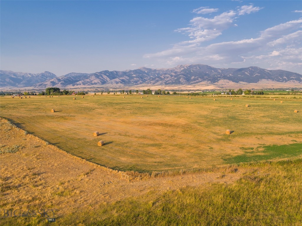 Development opportunity!  418.5 acres of prime development land just outside the northwest edge of Bozeman City limits.  Incredible property in the path of progress of Bozeman's growth.  Just one mile north of the new Gallatin High School and Northwest Crossing Subdivision, and just to the west of Baxter Meadows Subdivision.  This land has rolling hills and pasture land, and is the high point of the low valley to provide incredible views.  This is two separate lots being sold as one parcel.  There is a 1,209 SF home on the parcel that will convey with the land, along with additional structures including garage, sheds and grain bins.