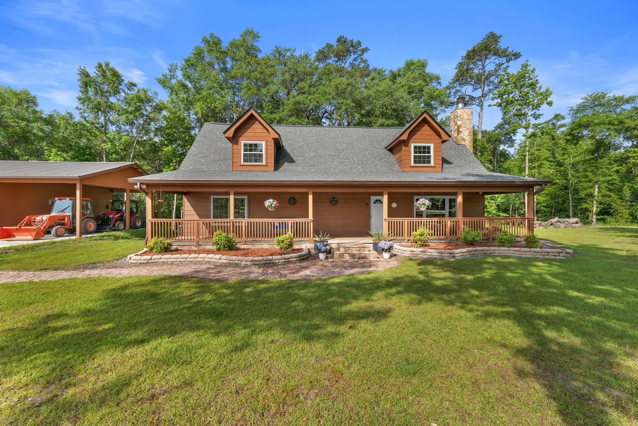 This expansive 78-acre estate, offers the perfect blend of tranquility and functionality with the convenience of living close to town.  Just 10 minutes to Quincy if you need to grab a quick bite or some groceries, and a short 20 minute drive to Tallahassee for shopping or a night out on the town.  Within a hour's drive to the gulf coast for some of the area's best fishing. Featuring a mix of fields and wooded areas, this property offers endless possibilities for recreation, running a business, farming, or a private retreat.  The 3/2 main house is perfectly positioned with a flowing creek just behind for a serene backdrop.  A separate 1/1 house ensures plenty of space for visitors or multi-generational living, updated in 2025.  For those needing serious work/hobby space, the brand new 60'X80' Morton shop features a covered/lighted front porch, front office, 5 mini-splits for climate control, a 60'X60" main shop area w/ 16' doors and LED lighting throughout.  6" concrete floors allow parking for the heaviest RVs or equipment safely inside.  Across the back of the building you have a private bathroom, a large storage room, a private workshop area, and a safe room/vault with a steel security door.  Upstairs you have a 60'X19' open storage area specifically built for high floor loads.  This shop is a standout feature, offering endless potential for hobbies/projects, equipment, or business use.  Outdoor enthusiasts will love the private gun range, shallow creeks, and ample land for hunting, farming, and/or exploring.  Abundant wildlife, as property is very close to Joe Budd Wildlife Management Area.  Main house has GenerLink transfer switch for a portable generator.  This rare find combines privacy, natural beauty, and modern amenities, making it an ideal homestead, getaway, or investment property.  All measurements are approximate, buyer to verify